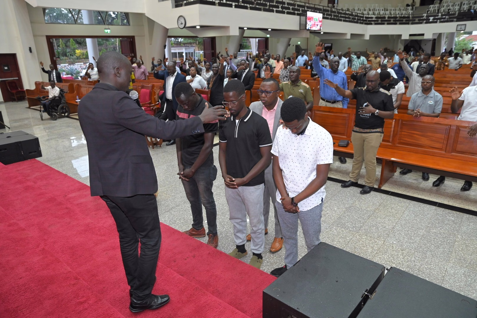 A conference leader connecting with other men