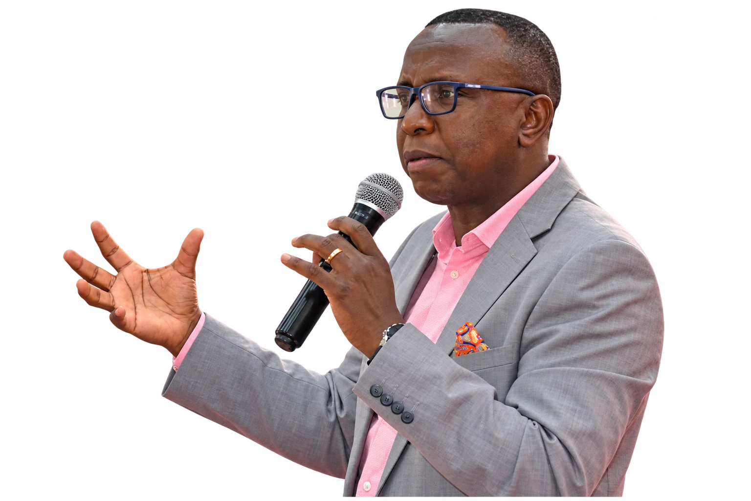 A conference speaker holding a microphone and gesturing as he teaches